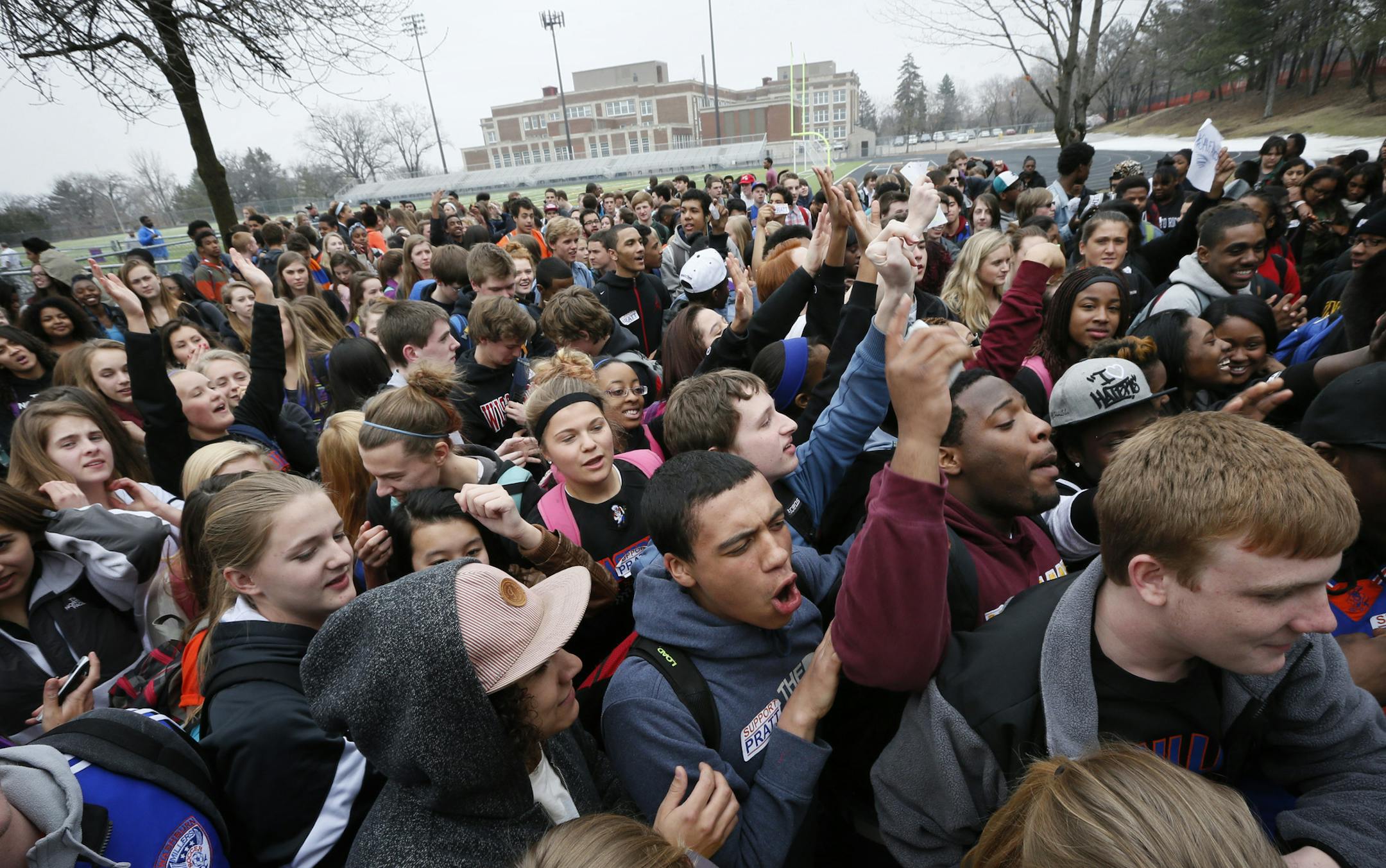 Hundreds of students poured out of Washburn High School early Monday afternoon in support of embattled school Athletic Director Dan Pratt. They gathered on the school's new synthetic turf field that Pratt and others raised money to buy and install. "We've got quite a group of kids," said Jamison Whiting, a senior four-sport athlete. Students and others involved with Washburn athletics said the issue involves whether Pratt obtained proper approvals for a scoreboard that was to be installed when t
