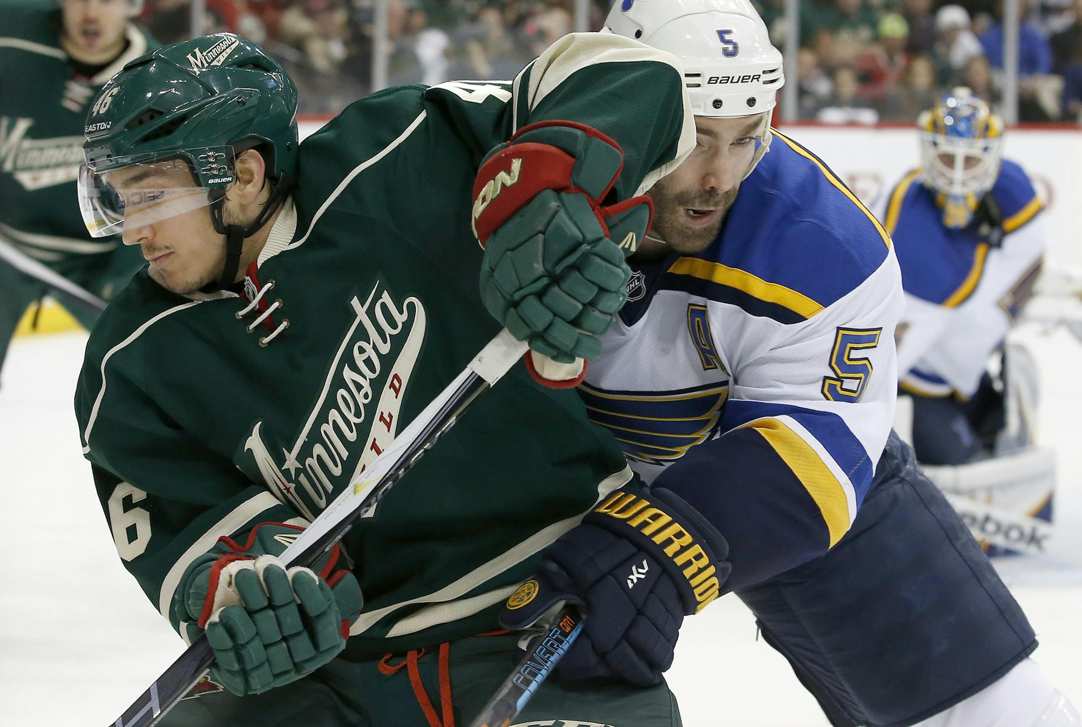 Jared Spurgeon (46) and Barret Jackman (5) fought for the puck in the second period. ] CARLOS GONZALEZ cgonzalez@startribune.com, April 22, 2015, St. Paul, Minn., Xcel Energy Center, NHL, Minnesota Wild vs. St. Louis Blues, Game 4, Stanley Cup Playoffs