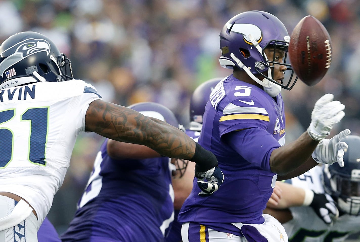 Seattle's Bruce Irvin (51) disrupted a pass by Vikings quarterback Teddy Bridgewater in the third quarter.