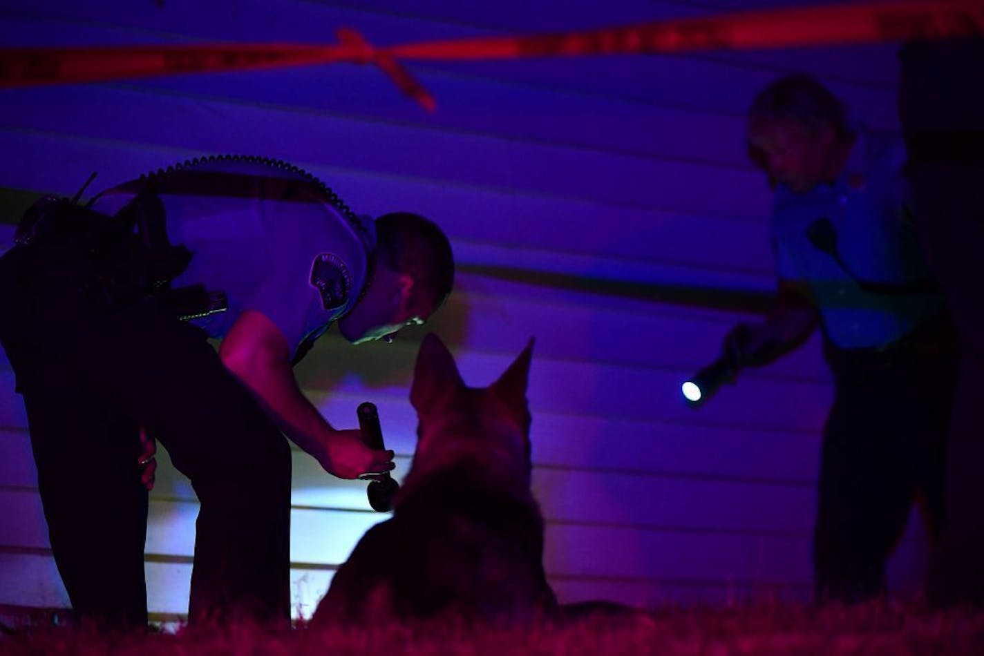 Minneapolis police looked for evidence next to a home near the scene of a fatal shooting at 21st and Penn avenues N. on Thursday night.