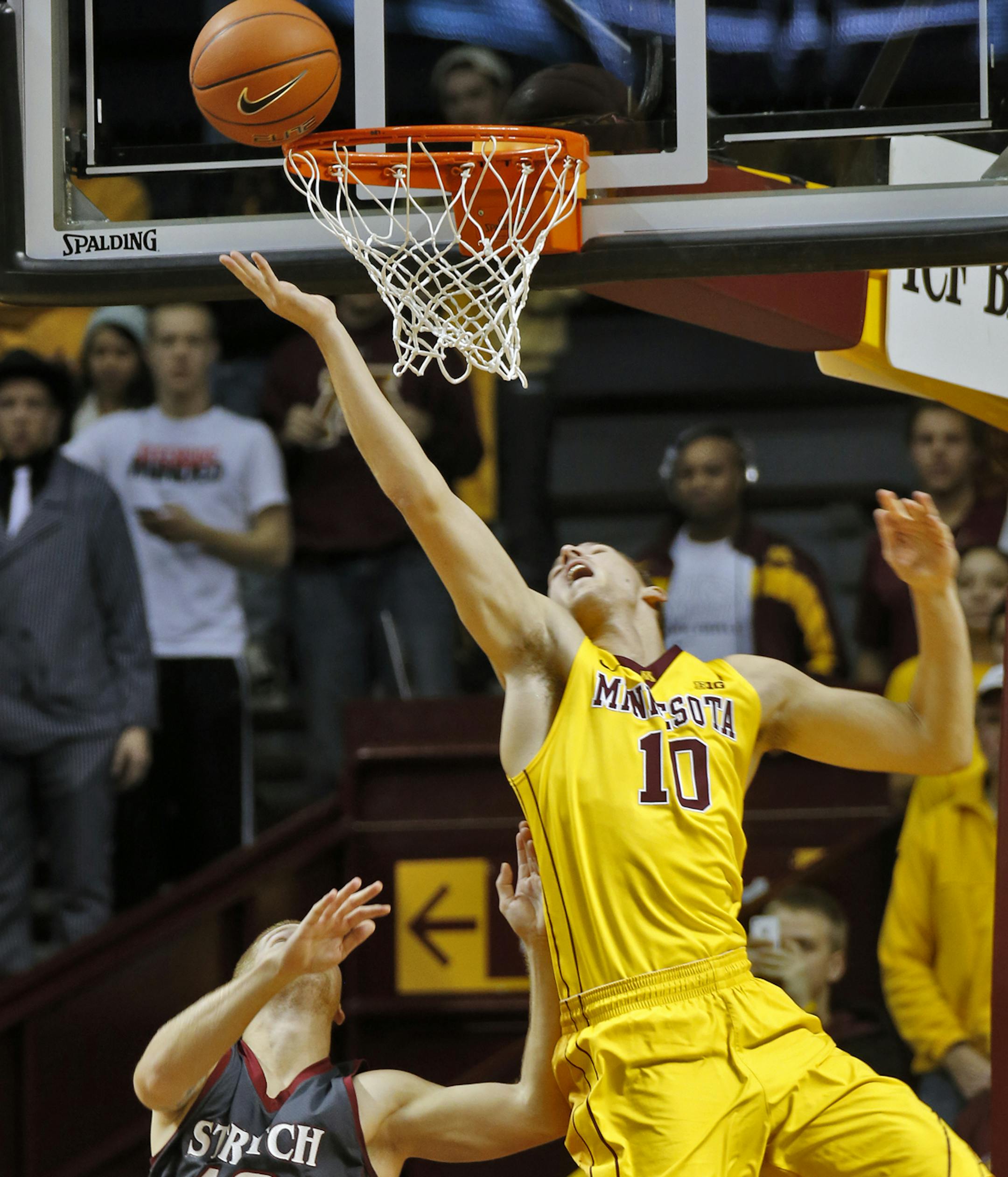 Minnesota Gophers vs. Cardinal Stritch Wolves basketball. Gophers Oto Osenieks (10) went up for two points beating the Wolves Chad Mazur (10) on the play. (MARLIN LEVISON/STARTRIBUNE(mlevison@startribune.com)