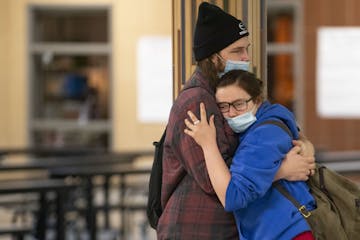 Gavin Lawrence embraced his girlfriend, Chace Johnson, in between classes at South Ridge School. It is one of only a few school buildings in Minnesota