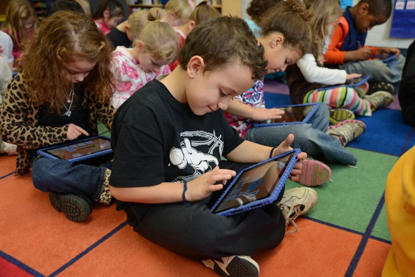 Kindergarten students at Royal Oaks Elementary School in Woodbury have begun using iPads in the classroom. Barbara Brown, a district spokeswoman, said there's no disputing that the children love to use them. The children were using ABC Spelling Magic which is an app that teaches the sounds of letters and how to build words.