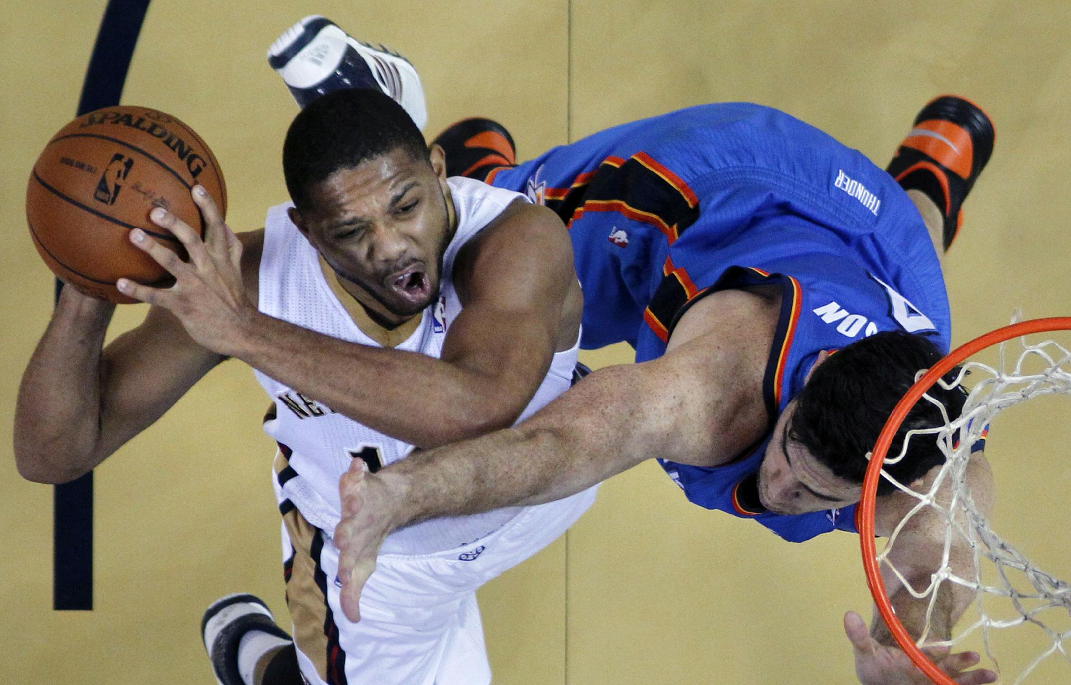 New Orleans Pelicans shooting guard Eric Gordon shoots against Oklahoma City Thunder power forward Nick Collison (4) in the first half of an NBA basketball game in New Orleans, Friday, Dec. 6, 2013. (AP Photo/Gerald Herbert)