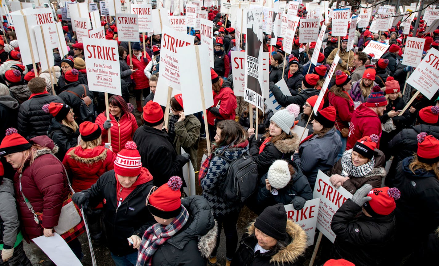 Demonstrators gather at the Global Arts Plus Upper Campus in St. Paul before marching to district headquarters Tuesday, March 10, 2020.