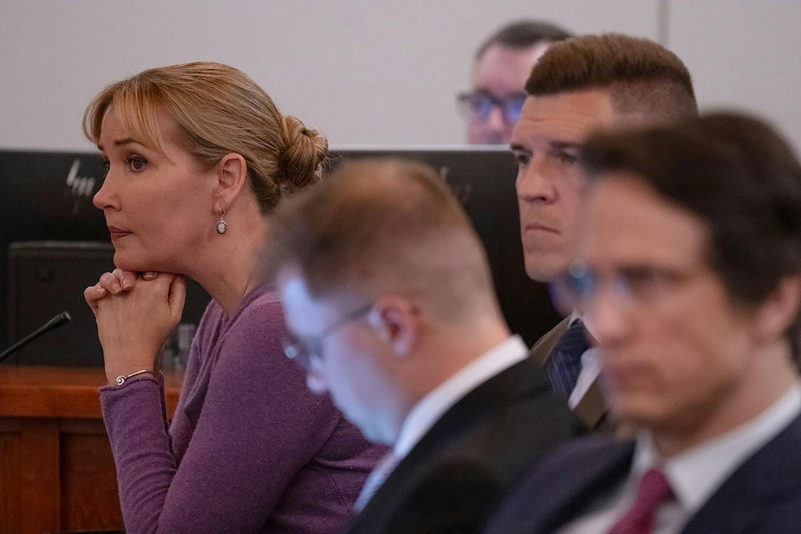 Democratic state Sen. Nicole Mitchell, left, flanked by her attorneys Dane DeKrey, Matthew Keller and Bruce Ringstrom Jr., listens during the opening statements of her trial on July 14, 2025, at Becker County District Court in Detroit Lakes, Minn.