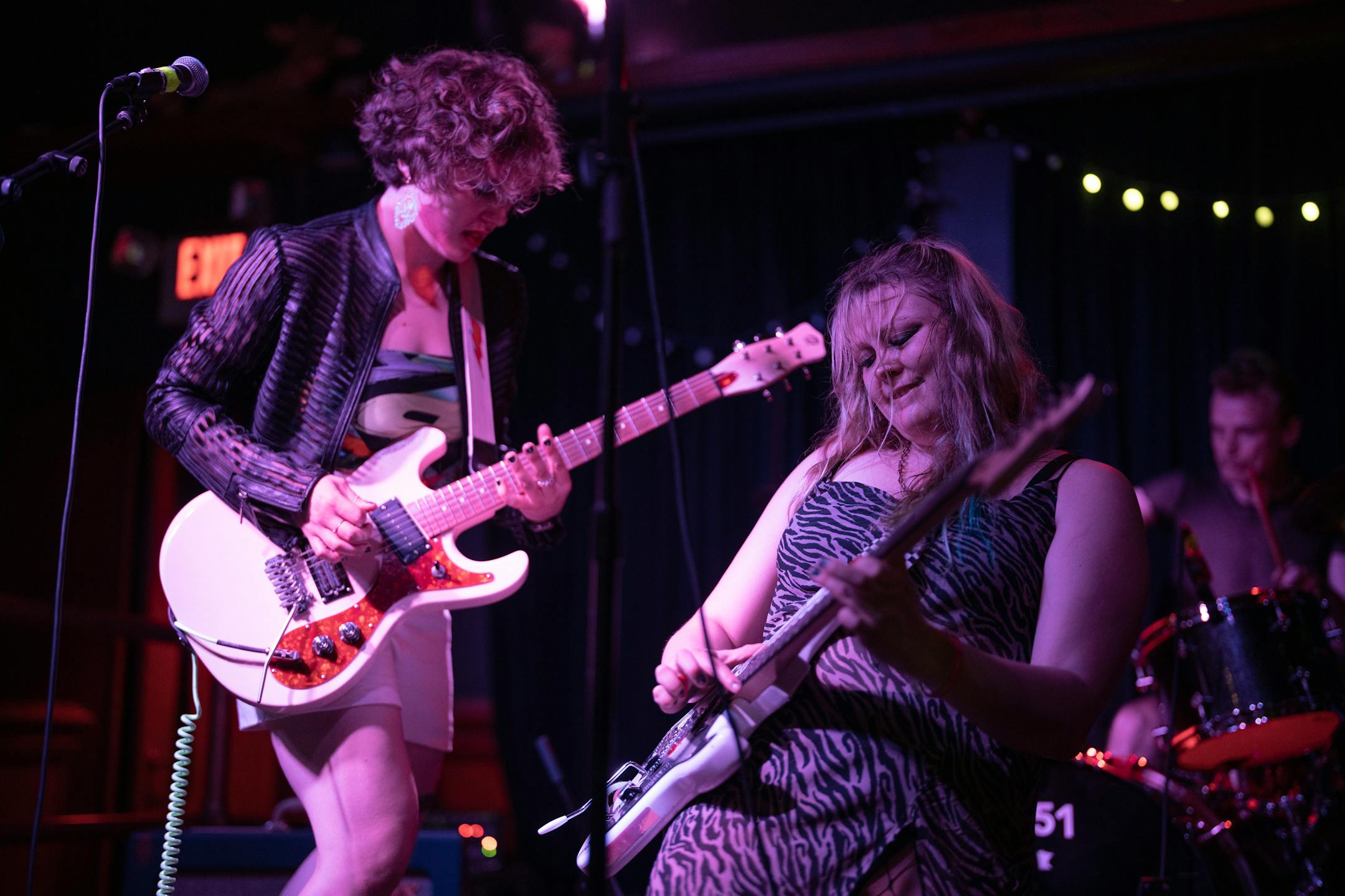 Eloise Boigenzahn, left, and Medbh McNamara of Surly Grrly performing during the first show of their Pride Month residency at Mortimer's in Minneapolis Wednesday night, June 7, 2023. Minneapolis power-punk trio Surly Grrly is leading the "It Smells Like Queer in Here" residency series at Mortimer's in June with fellow queer punk groups, part of a long string of shows by these rowdy and fun envelope-pushers. ] JEFF WHEELER • jeff.wheeler@startribune.com