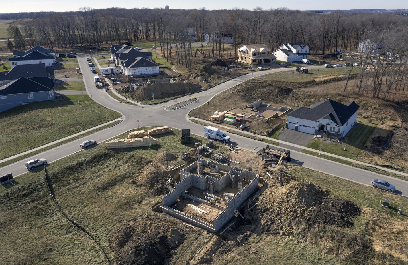 Last month was the busiest October in 15 years for home builders in the Twin Cities, according to a monthly report from Housing First Minnesota. Builders say demand for single-family houses is being driven by a shortage of existing houses that are affordable to Millennials buying their first home, and strong demand for suburban houses that appeal to buyers who are considering a future that includes more time working from home. Here, homes are going up fast at Woodland Cove in Minnetrista. brian.