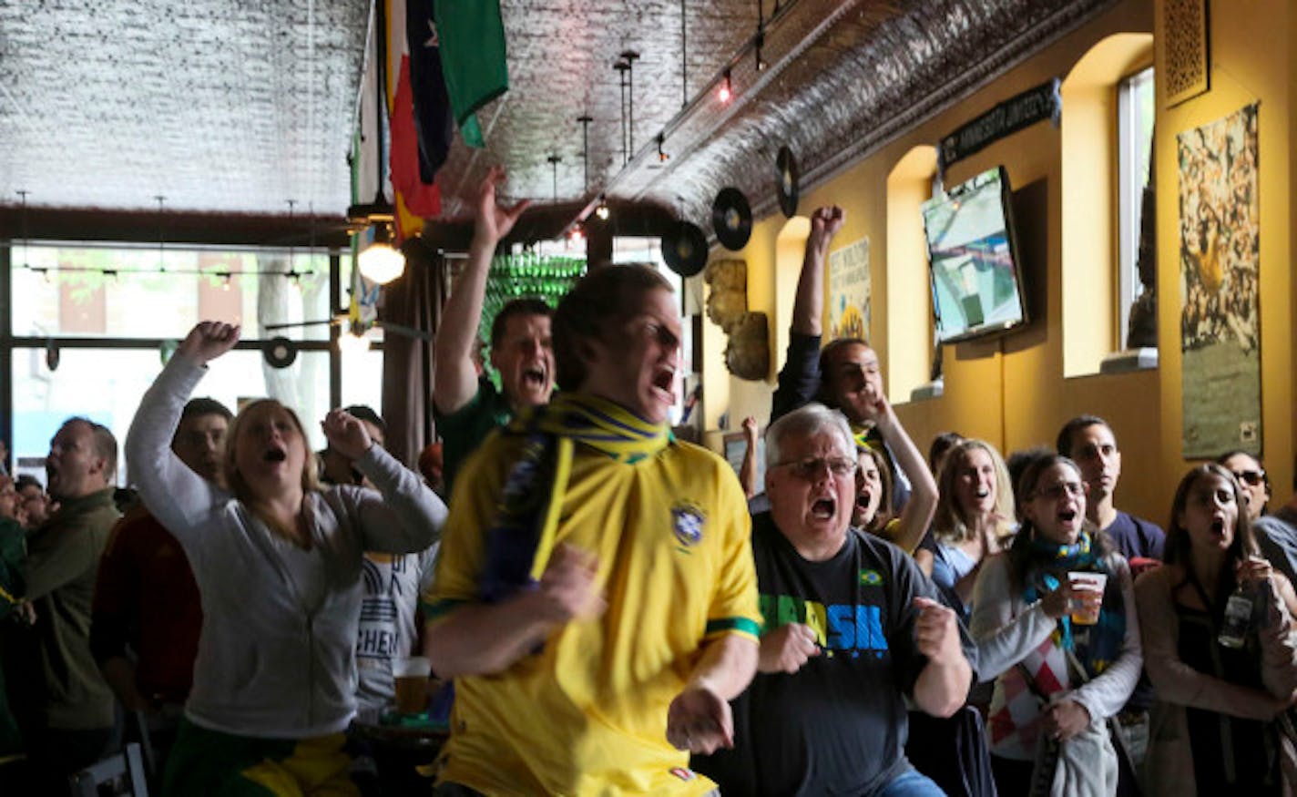 Nomad World Pub patrons watching World Cup soccer in 2014 might also react this way to news the bar is for sale. / Star Tribune file