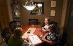 Edina Realty realtor Kath Hammerseng, left, talked Christine Arnoldi and her daughter, Andrea, through the process of listing Christine's house on the