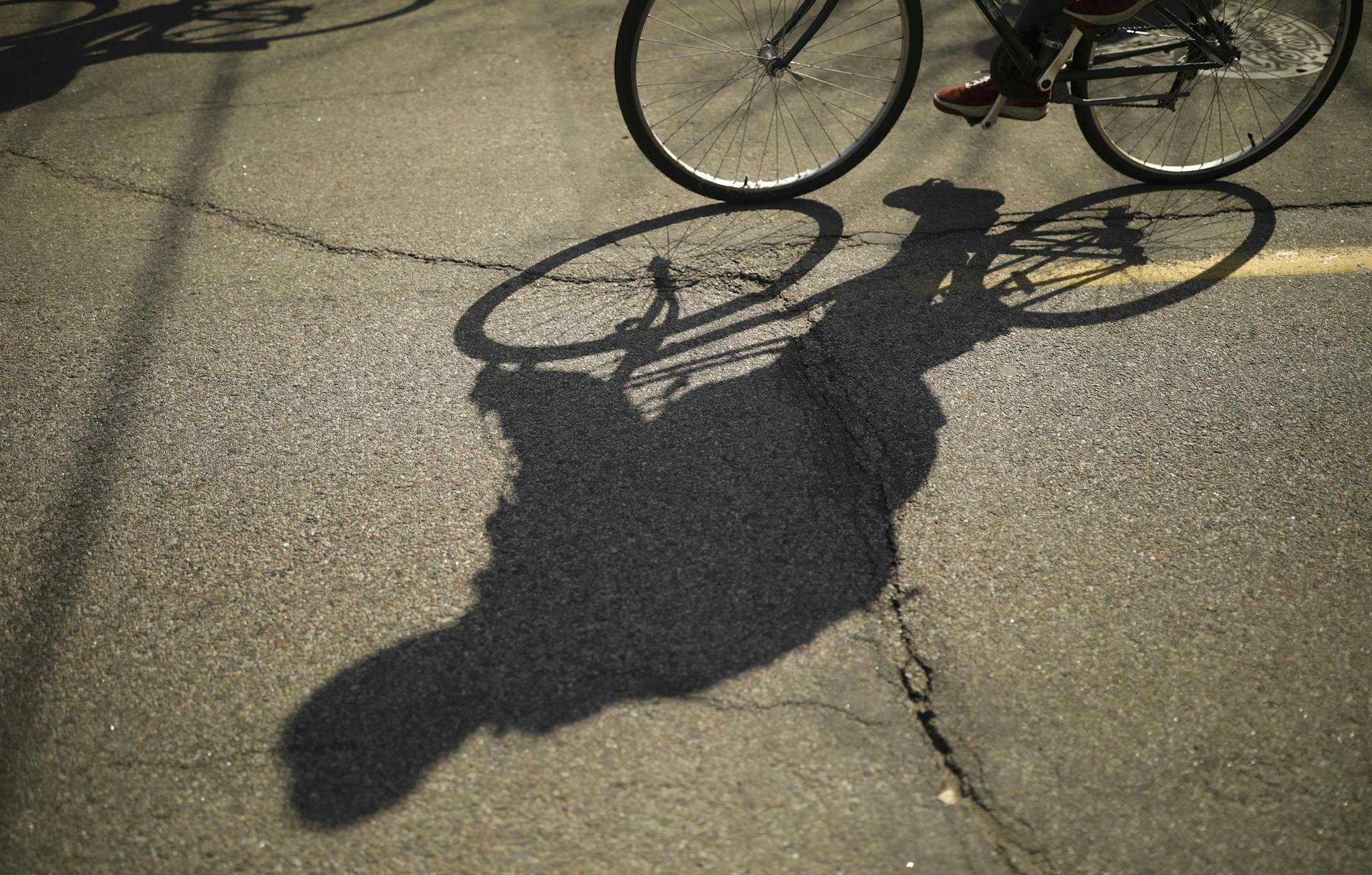 Riders' shadows on 40th St. as they set out from Farmstead Bike Shop Sunday afternoon. ] JEFF WHEELER • jeff.wheeler@startribune.com The Farmstead Bike Shop hosted a family-friendly Ice Cream Ride from their shop at 40th St. and Bryant Ave. S. to kick off 30 Days of Biking Sunday afternoon, April 1, 2018 in Minneapolis. The shop will hold similar rides at least one Sunday each month through the summer and probably into September, said co-owner Greg Neis.