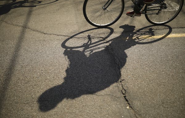 Riders' shadows on 40th St. as they set out from Farmstead Bike Shop Sunday afternoon. ] JEFF WHEELER &#x2022; jeff.wheeler@startribune.com The Farmst