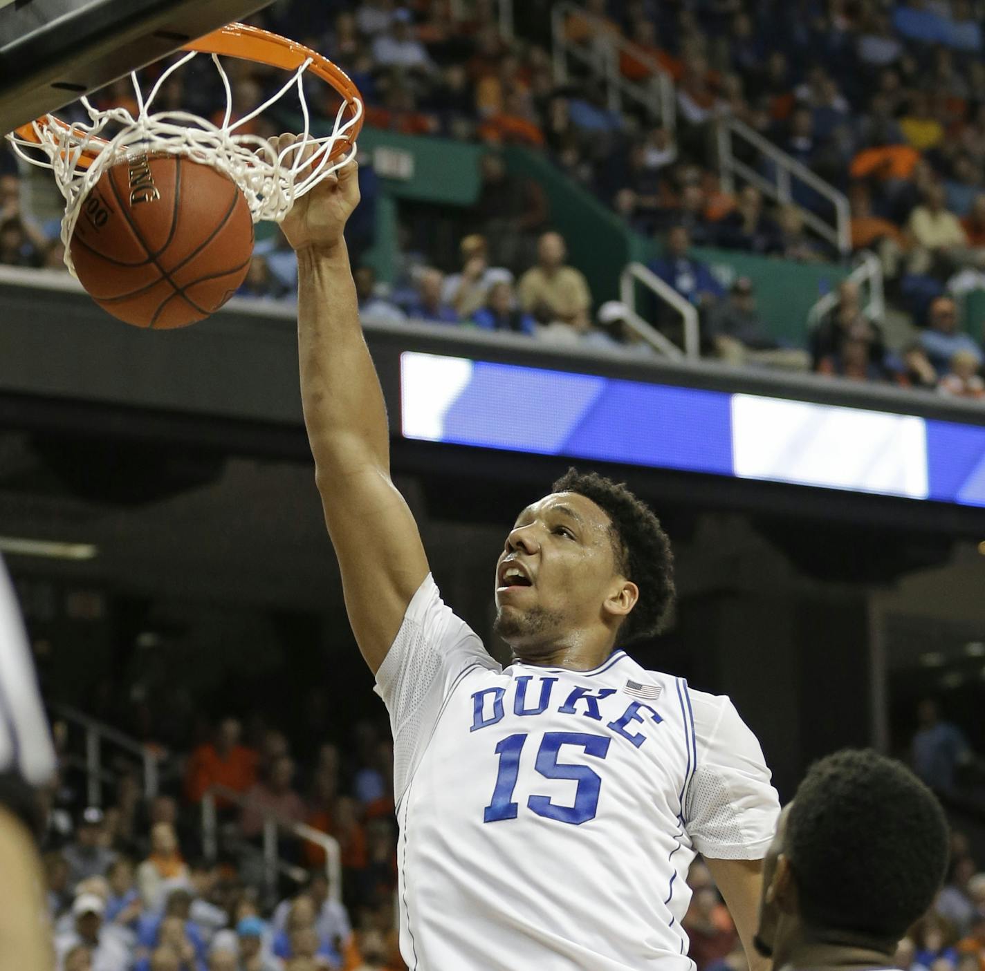 FILE - In this March 13, 2015, file photo, Duke's Jahlil Okafor (15) dunks against Notre Dame during the first half of an NCAA college basketball game in the semifinals of the Atlantic Coast Conference tournament in Greensboro, N.C. Okafor was selected to the Mens All-America team, Monday, March 30, 2015. (AP Photo/Bob Leverone, File)