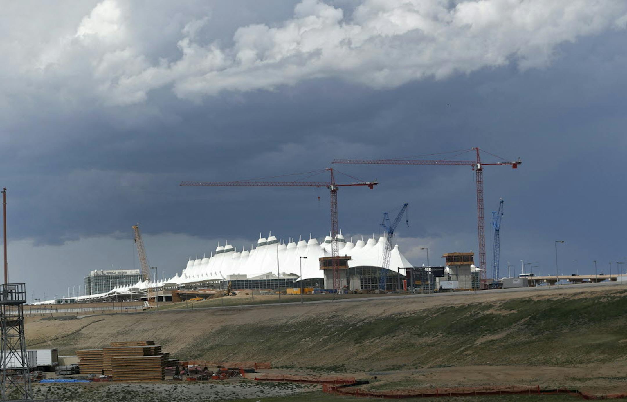 Storm clouds are seen over Denver International Airport on Tuesday, where a tornado touched down and forced passengers and employees into shelters. No one was injured and there was no apparent damage.