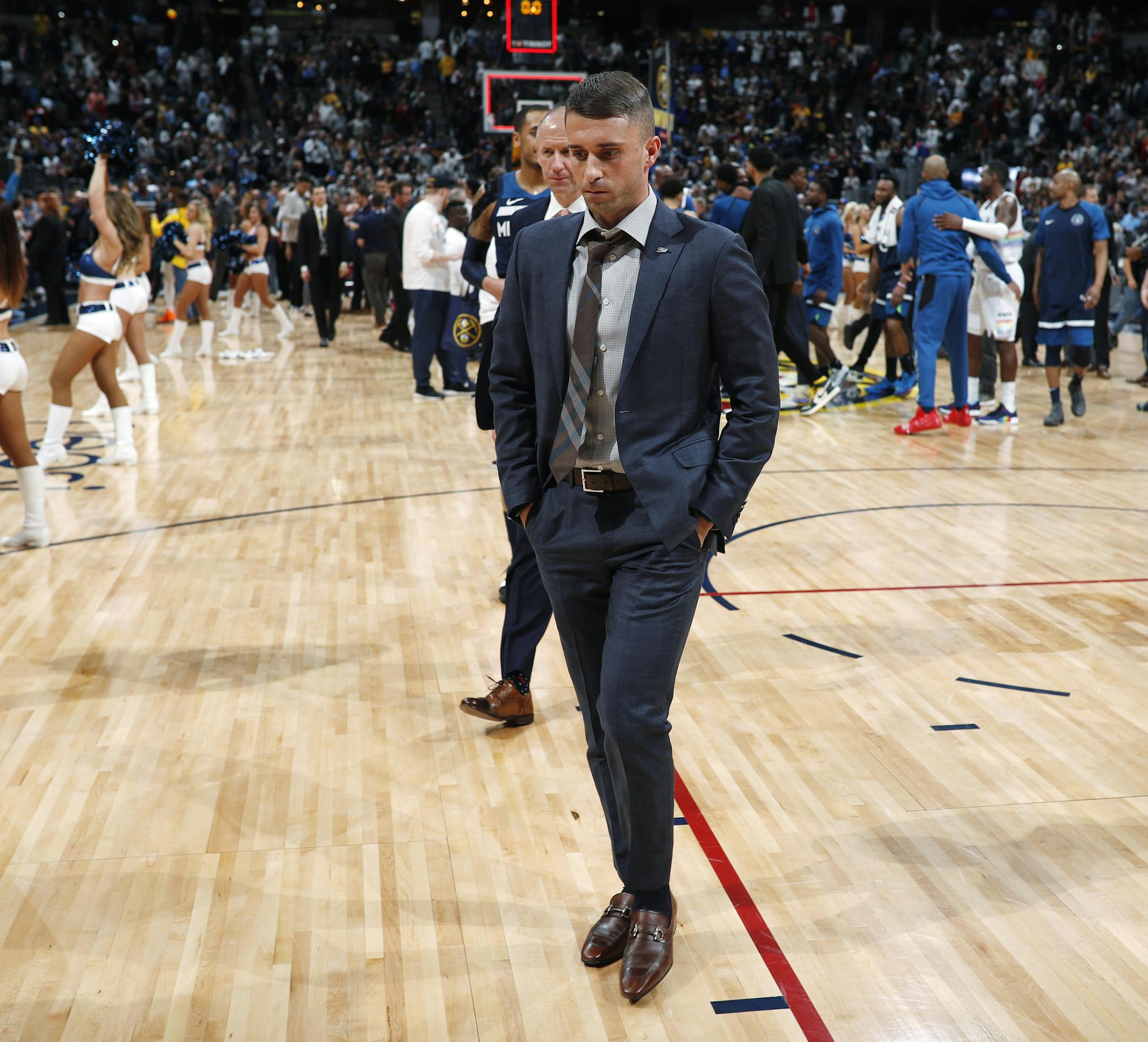 Minnesota Timberwolves coach Ryan Saunders heads off the court after the team's NBA basketball game against the Denver Nuggets on Wednesday, April 10, 2019, in Denver. The Nuggets won 99-95. (AP Photo/David Zalubowski)