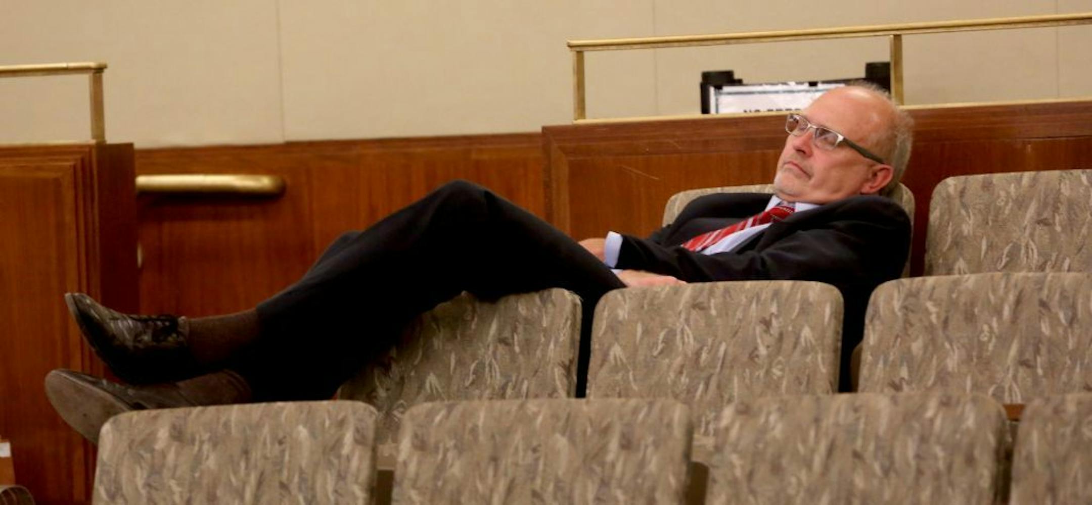 Minnesota senator Roger C. Chamberlain rested during recess during the special session.