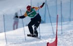 Mike Schultz of St. Cloud (shown in the 2018 Winter Paralympics) won the world title in banked slalom Wednesday at the world para snowboard championsh