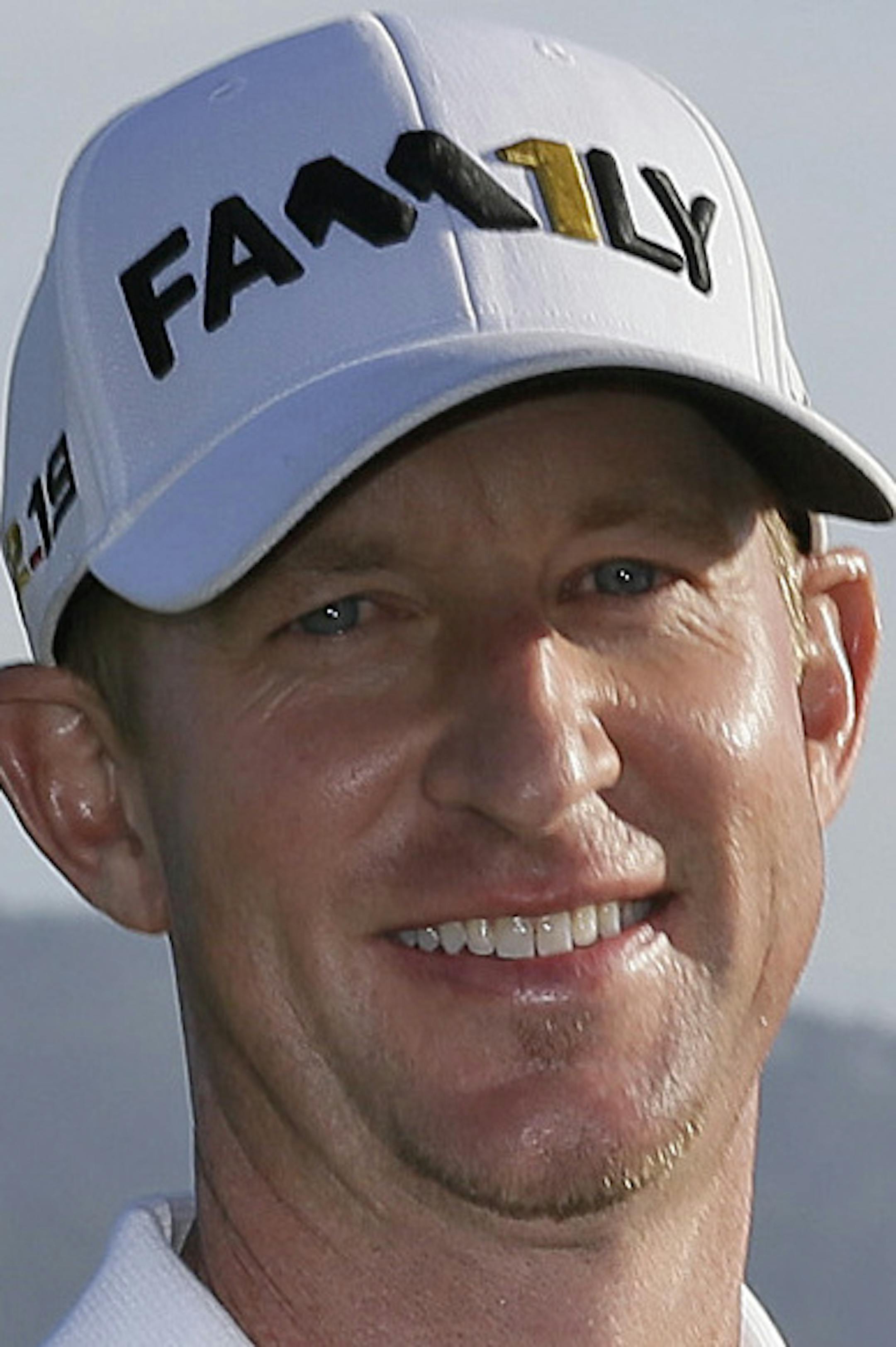 Vaughn Taylor poses with his trophy on the 18th green of the Pebble Beach Golf Links after winning the AT&T Pebble Beach National Pro-Am golf tournament Sunday, Feb. 14, 2016, in Pebble Beach, Calif. (AP Photo/Eric Risberg)