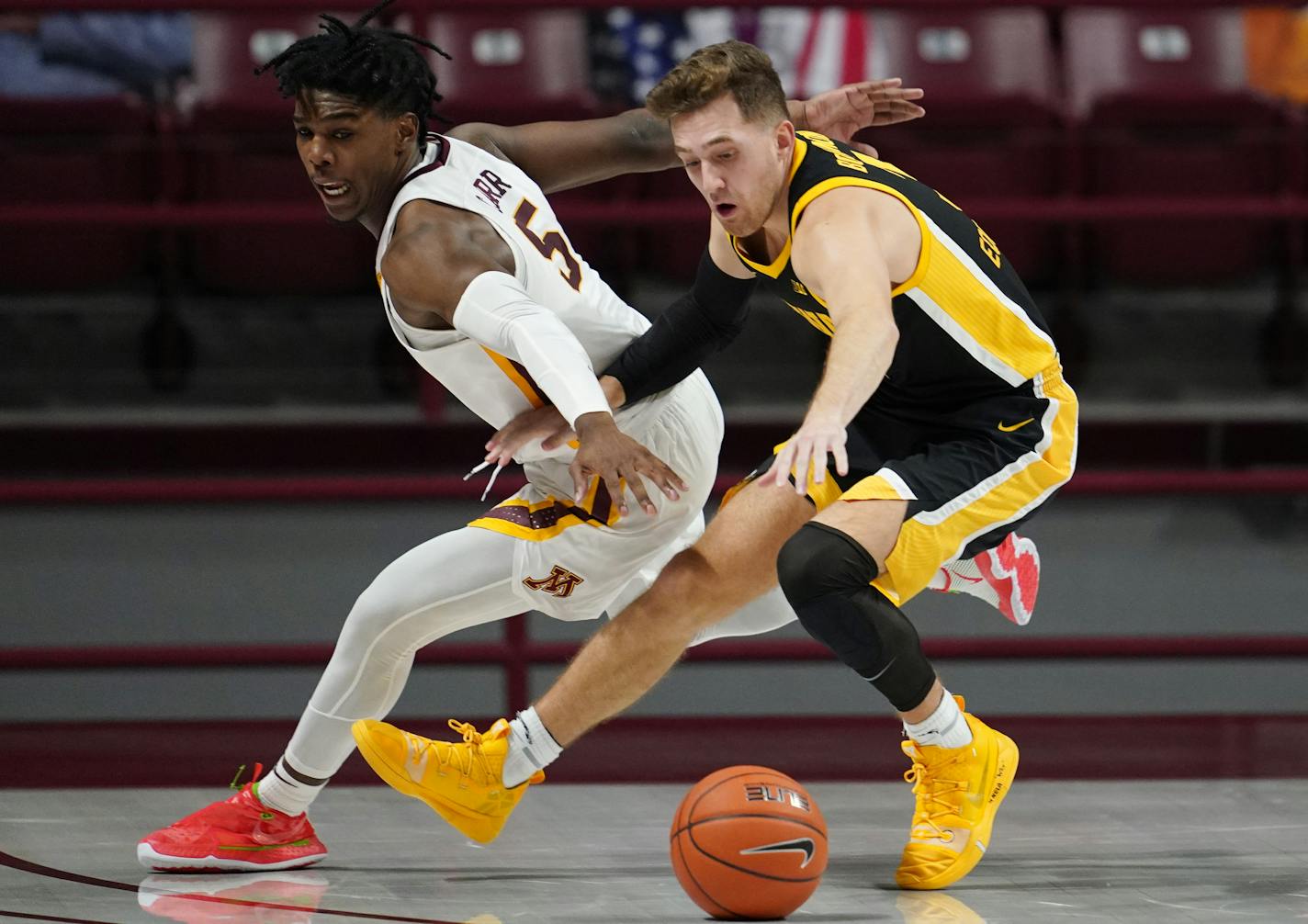 Minnesota guard Marcus Carr (5) and Iowa guard Jordan Bohannon (3) raced for a loose ball in the second half. ] ANTHONY SOUFFLE • anthony.souffle@startribune.com