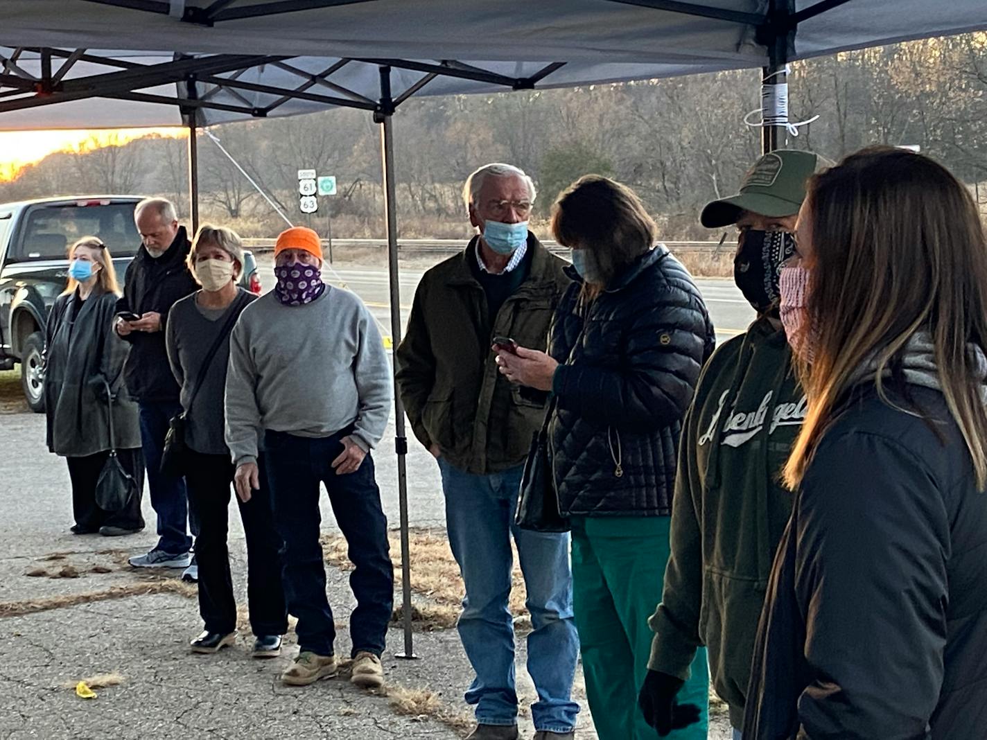 Joshua Sanders and Heather Hawk of Lake City, at right, joined voters lined up at the polls Tuesday outside Florence Town Hall in Frontenac.