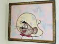 A painting of Speedy Gonzales by artist Dino Perez hangs at the home office of Gustavo Arellano, a columnist for the Los Angeles Times.