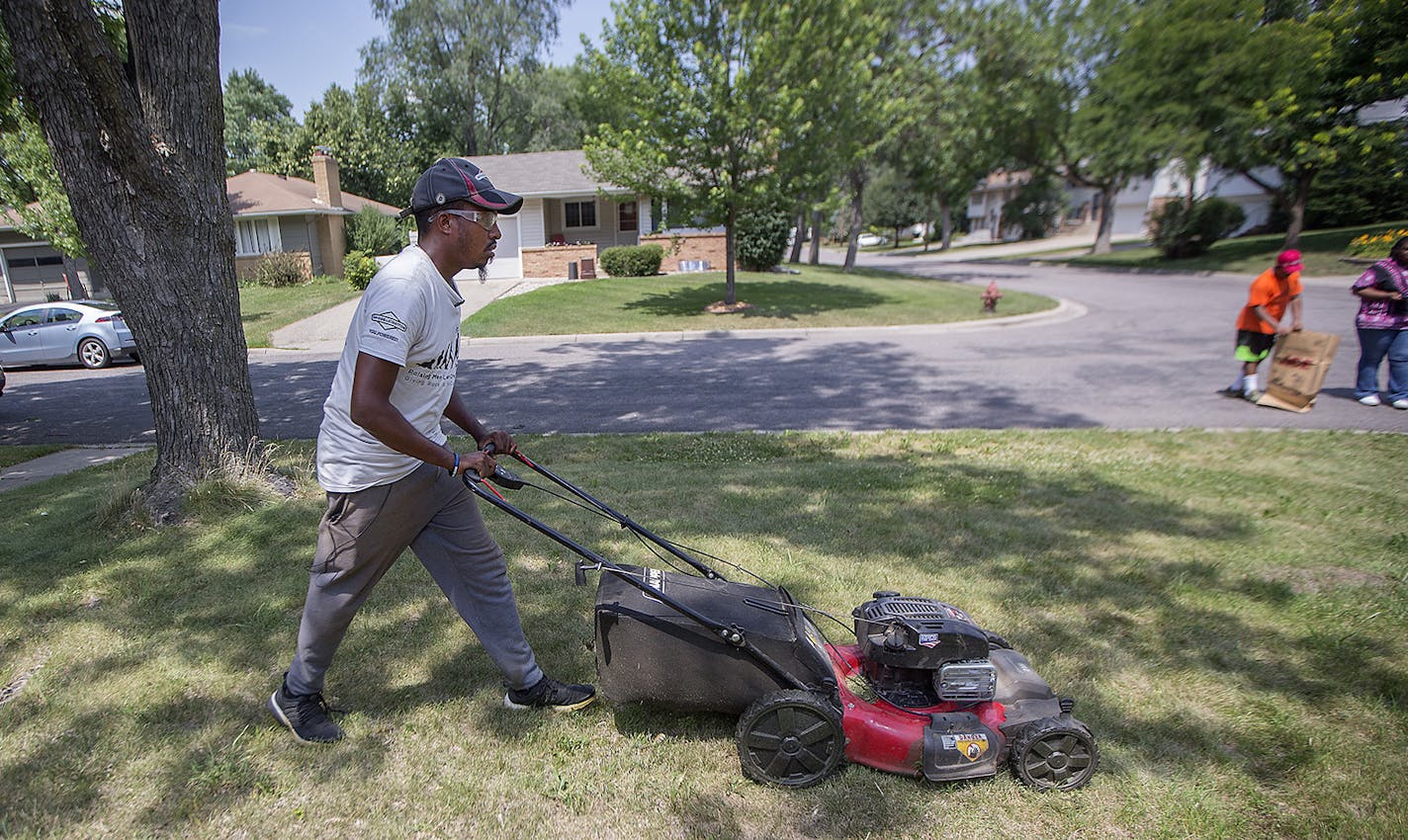 After mowing a lawn in St. Paul, Rodney Smith mowed his third lawn of the day in his 48th state, Thursday, July 12, 2018 in Hopkins, MN. The home belonged to a single woman who cares for special needs children. Smith said he received a call from God to help others by mowing his way across country. He also receives help from young boys who volunteer to help him. ] ELIZABETH FLORES &#xef; liz.flores@startribune.com