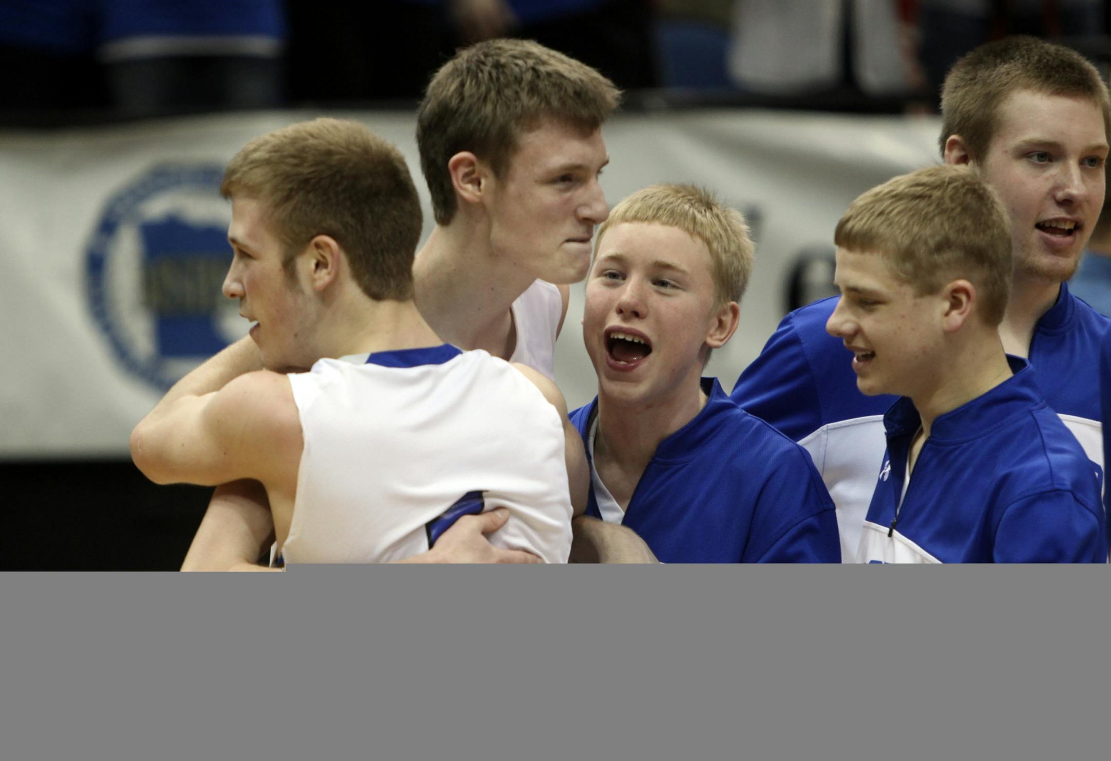 Belgrade-Brooten-Elrosa teammaet hugged Billy Borgerding after beating Southwest Minnesota Christian for the Class 1A championship at Target Center in Minneapolis Min., Saturday, March 24, 2012. Belgrade-Brooten-Elrosa won 54-45.It was Borgerding's birthday Saturday.
