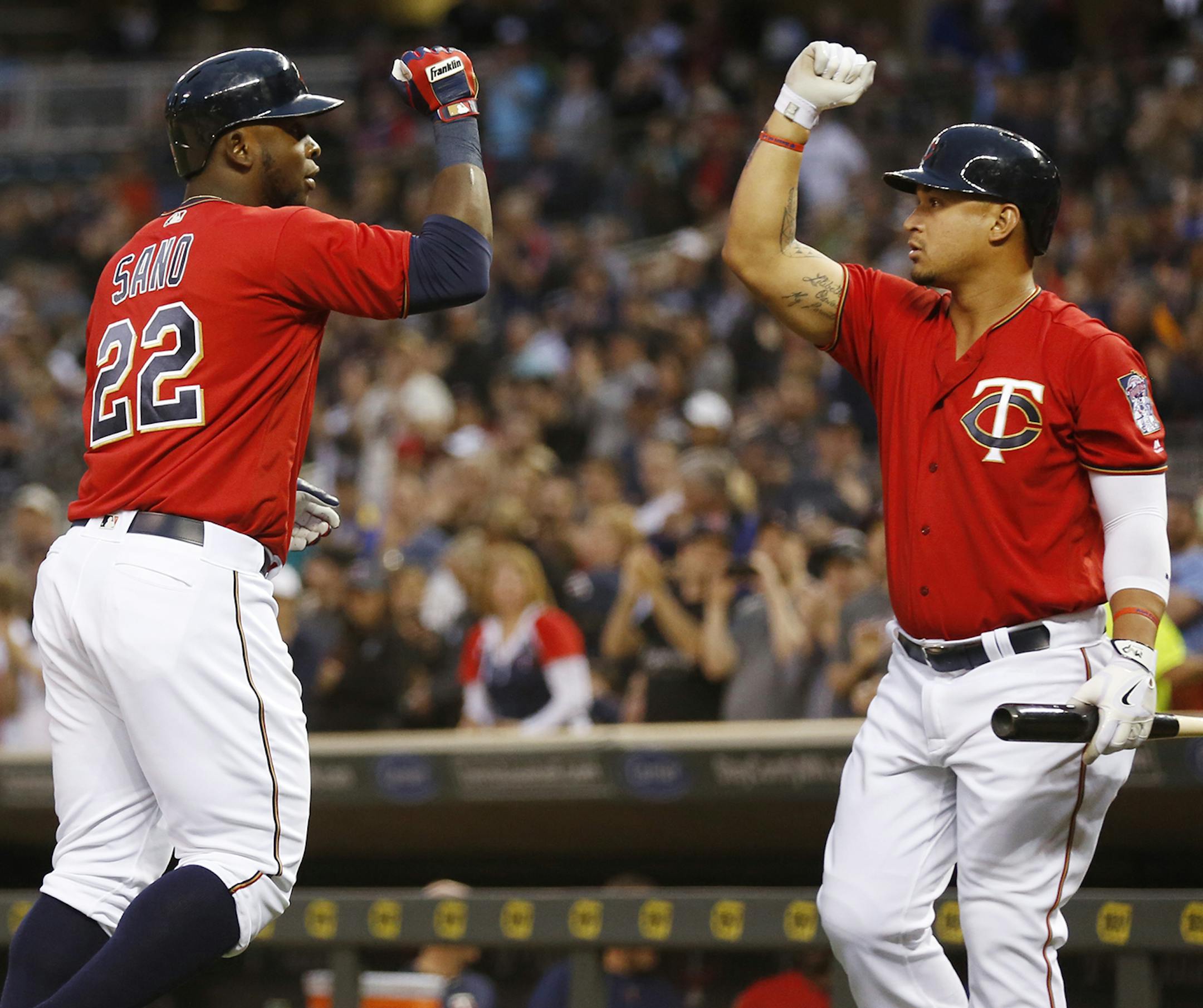 Minnesota Twins right fielder Miguel Sano (22) celebrates with teammate Minnesota Twins center fielder Byron Buxton (25) after hitting a home run. ] (Leila Navidi/Star Tribune) leila.navidi@startribune.com BACKGROUND INFORMATION: The Minnesota Twins play the Milwaukee Brewers at Target Field in Minneapolis on Monday, April 18, 2016.