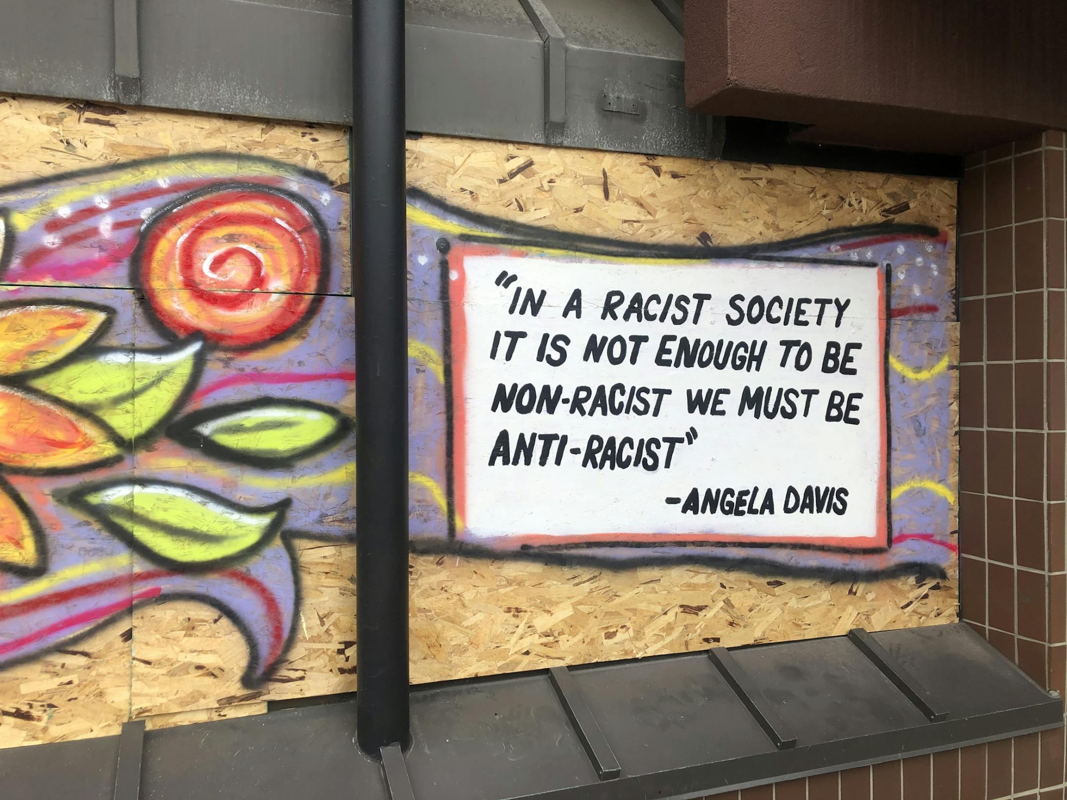 A quote from Angela Davis is painted at 2626 Hennepin Ave.