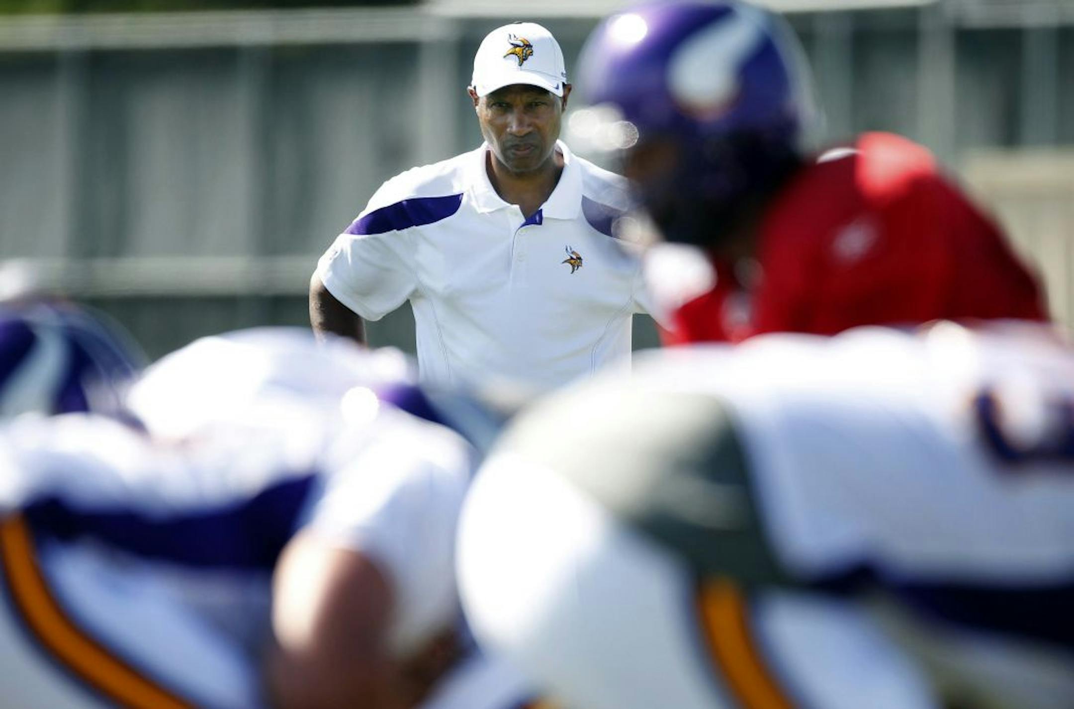 Minnesota Vikings head coach Leslie Frazier watched quarterback Donovan McNabb (5) line up under center during practice on Thursday afternoon at Minnesota State University, Mankato. McNabb had to wait until the CBA was ratified before participating in the afternoon practice.
