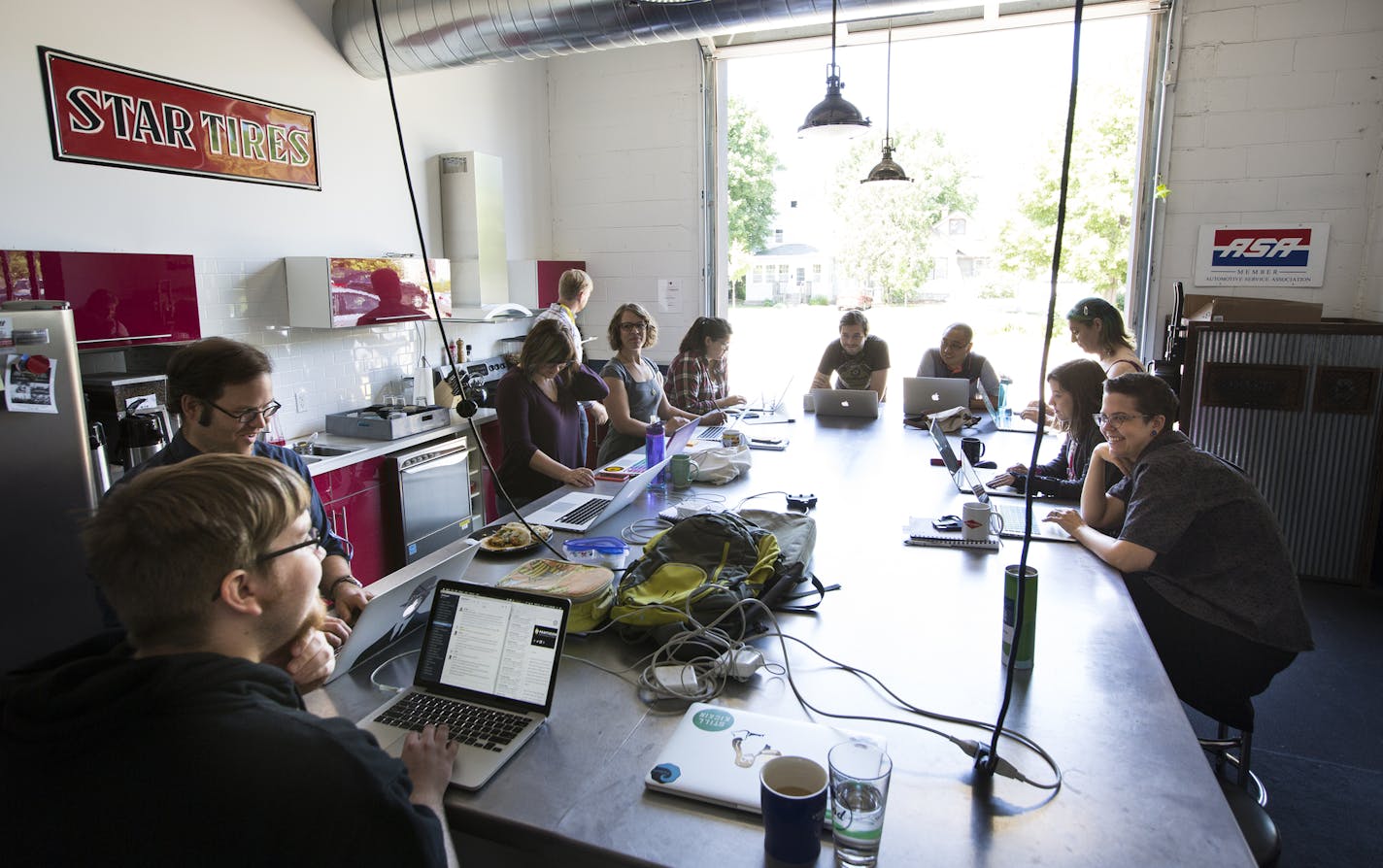 Employees work in the communal kitchen area at the Clockwork office in Minneapolis. ] (Leila Navidi/Star Tribune) leila.navidi@startribune.com BACKGROUND INFORMATION: Tuesday, June 7, 2016 in Minneapolis. Clockwork Active Media once again topped the Top Workplaces list for small businesses.