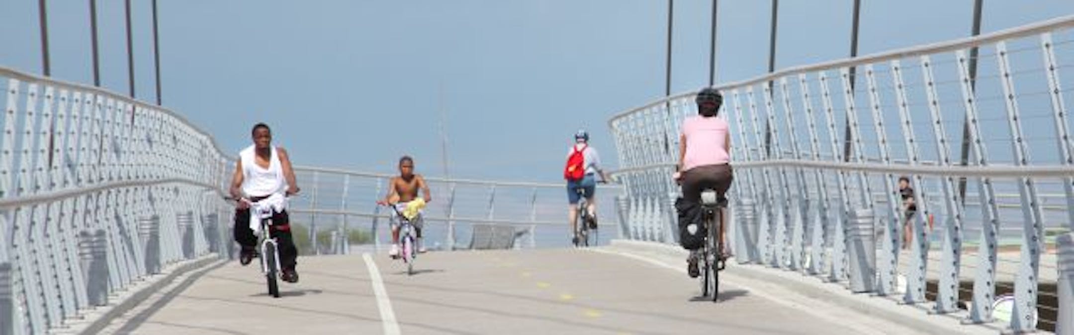Cyclists rolled across the Greenway bridge over Hiawatha Avenue in Minneapolis on Tuesday. Cycling and safety advocates say an increase in cycling may help make it safer for cyclists to be on the road.