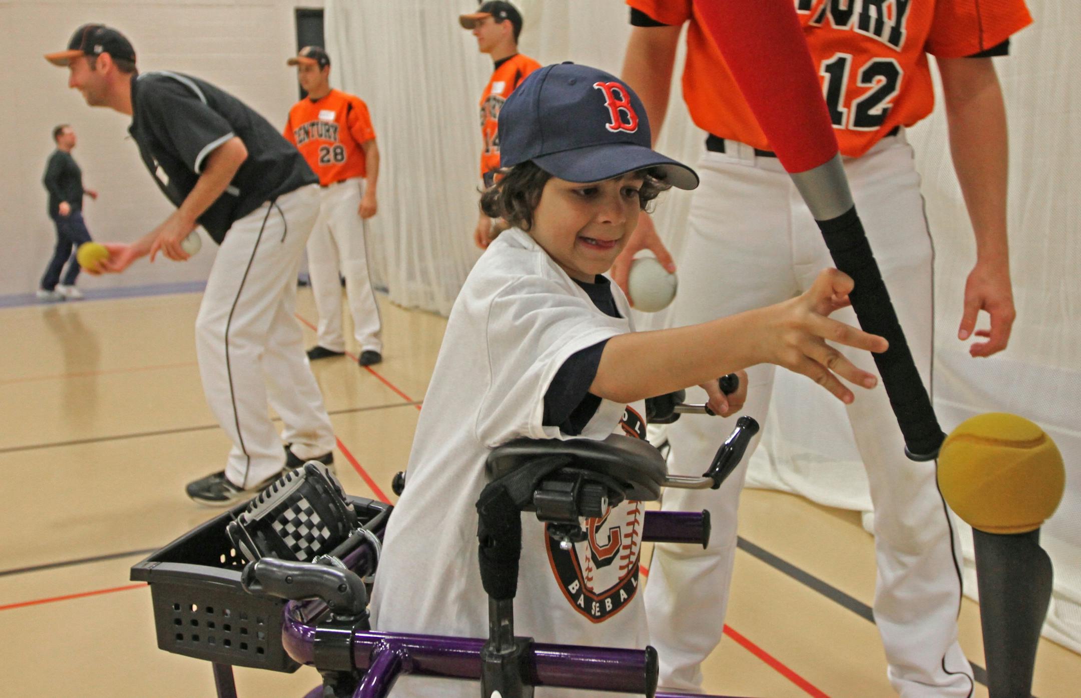 Seven-year-old Alexander DiPaola of Minneapolis got ready to grab a bat and take some swings at a clinic for Miracle League players put on by the Century College baseball team in their gym in White Bear Lake last Saturday.