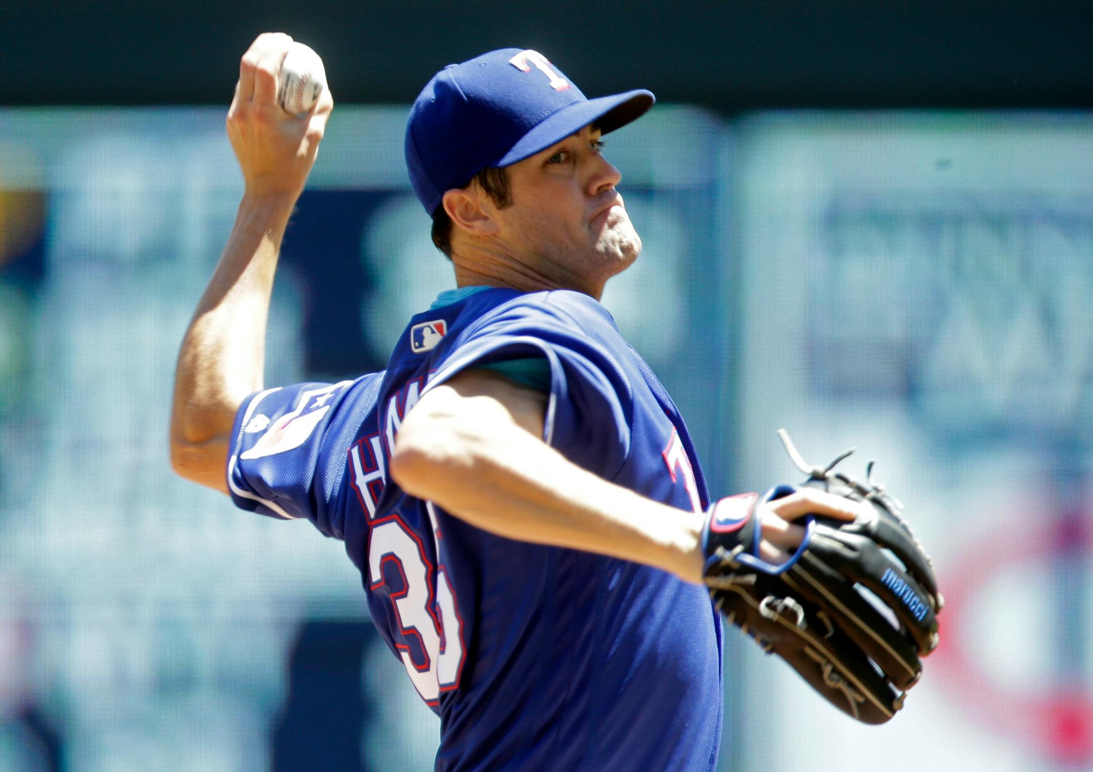 Texas Rangers pitcher Cole Hamels throws against the Minnesota Twins in the first inning of a baseball game Sunday, July 3, 2016, in Minneapolis. (AP Photo/Jim Mone)