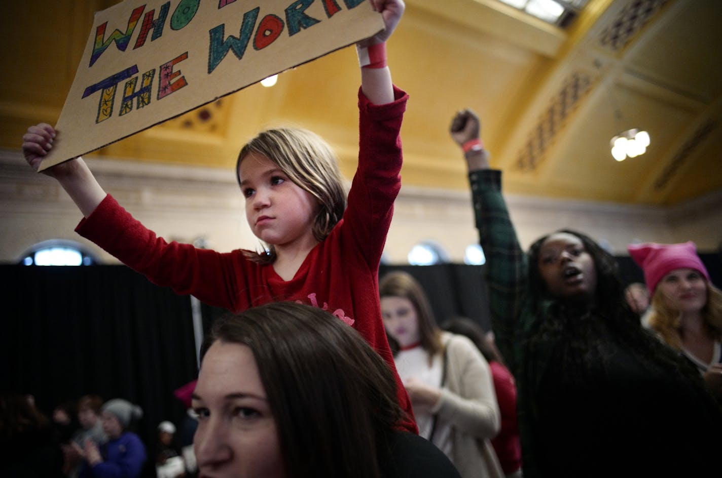 Jolene,5, atop her mother Amelia Hobbins of Rogers, held up a sign that read,"who rules the world." Hobbies says she "came to expose my daughter to feminism and activism." About 2,500 people, mostly women were expected to attend.]Women's March Minnesota presents: Hear Our Voice! Today marks the year anniversary for the Women's March. In honor of that, there will be a big gathering at the Union Depot to honor that, and to rally.Richard Tsong-Taatarii&#xef;rtsong-taatarii@startribune.com