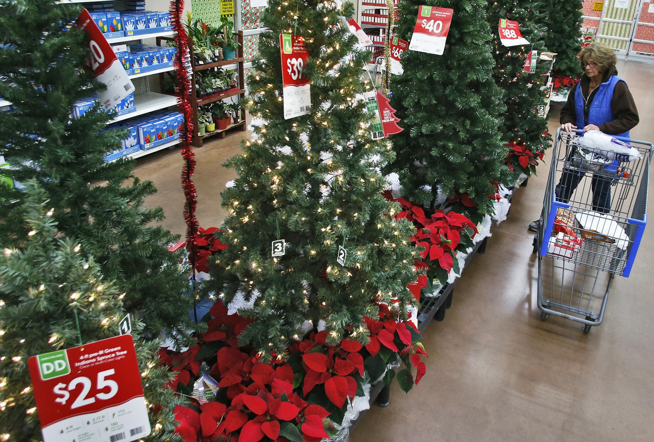 Shoppers at Walmart store in St. Anthony getting a head start on Christmas shopping. Pat Norman of New Brighton shopped for Christmas trees. (MARLIN LEVISON/STARTRIBUNE(mlevison@startribune.com)