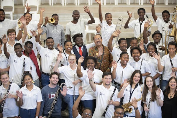 Minnesota Orchestra members pose for a group photo with the KwaZulu Natal Youth Wind Band.