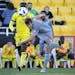 Minnesota United midfielder Collin Martin (17) passes the ball during the first half of an MLS match against the Columbus Crew, Saturday, Feb., 24, 20