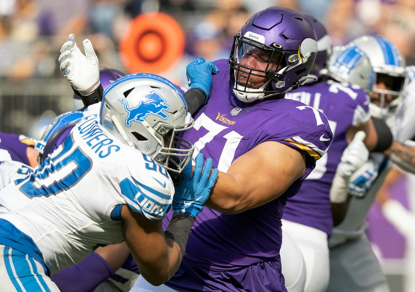 Trey Flowers (90) of the Detroit Lions was blocked by Minnesota Vikings tackle Christian Darrisaw (71).