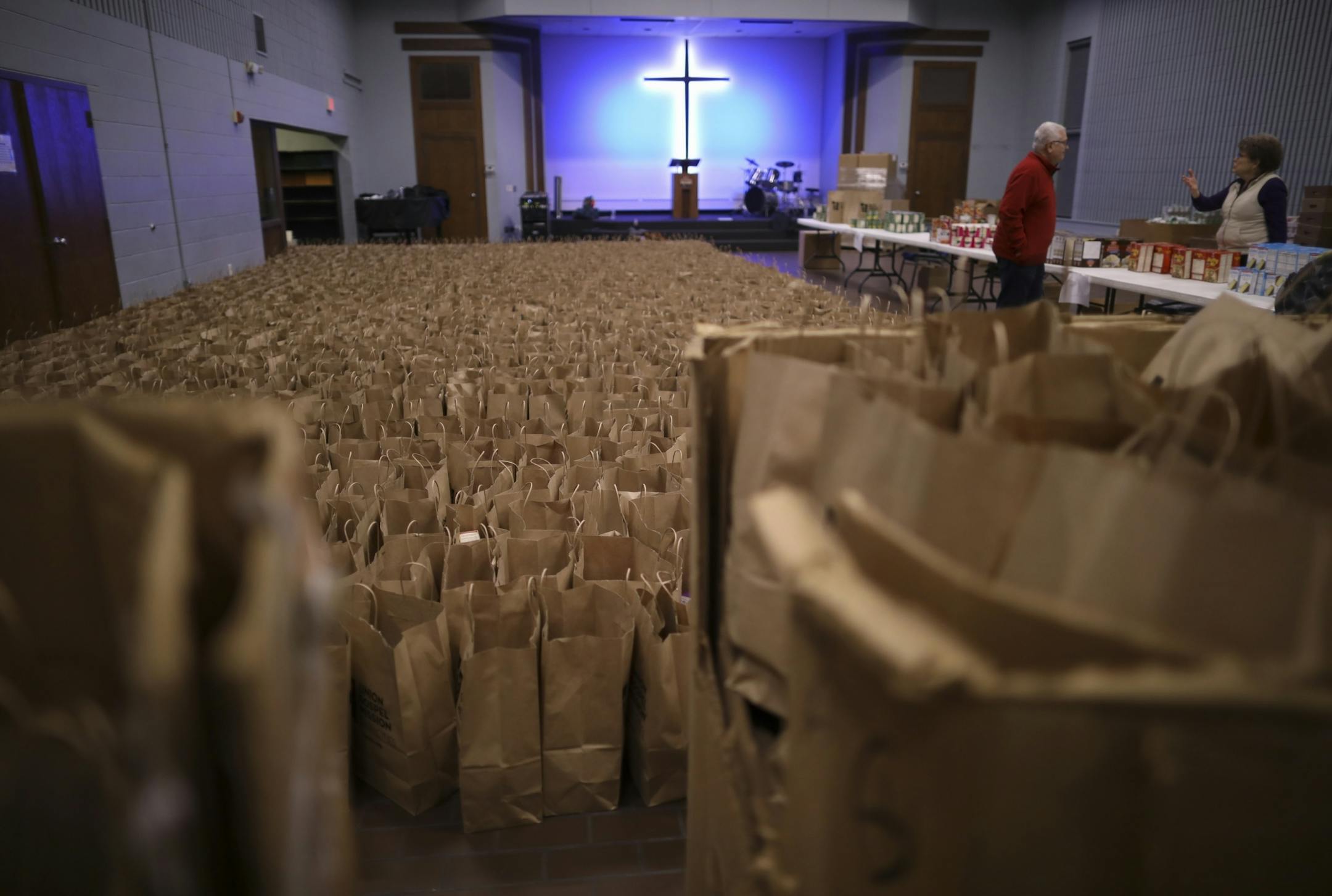 Some of the thousands of grocery bags packed by volunteers at the Union Gospel Mission, each containing all the fixings, that when combined with the turkeys also distributed, make a complete Thanksgiving meal.