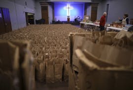 Some of the thousands of grocery bags packed by volunteers at the Union Gospel Mission, each containing all the fixings, that when combined with the t