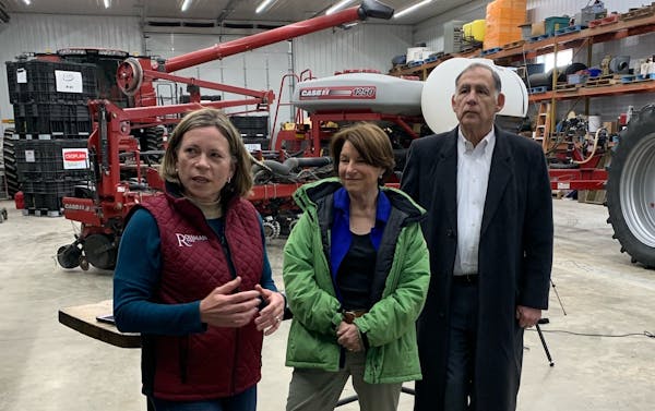 Minnesota Sen. Amy Klobuchar, center, a Democrat and member of the Senate Agriculture Committee, toured Rossman Farm in Oronoco, Minn., on April 21 wi