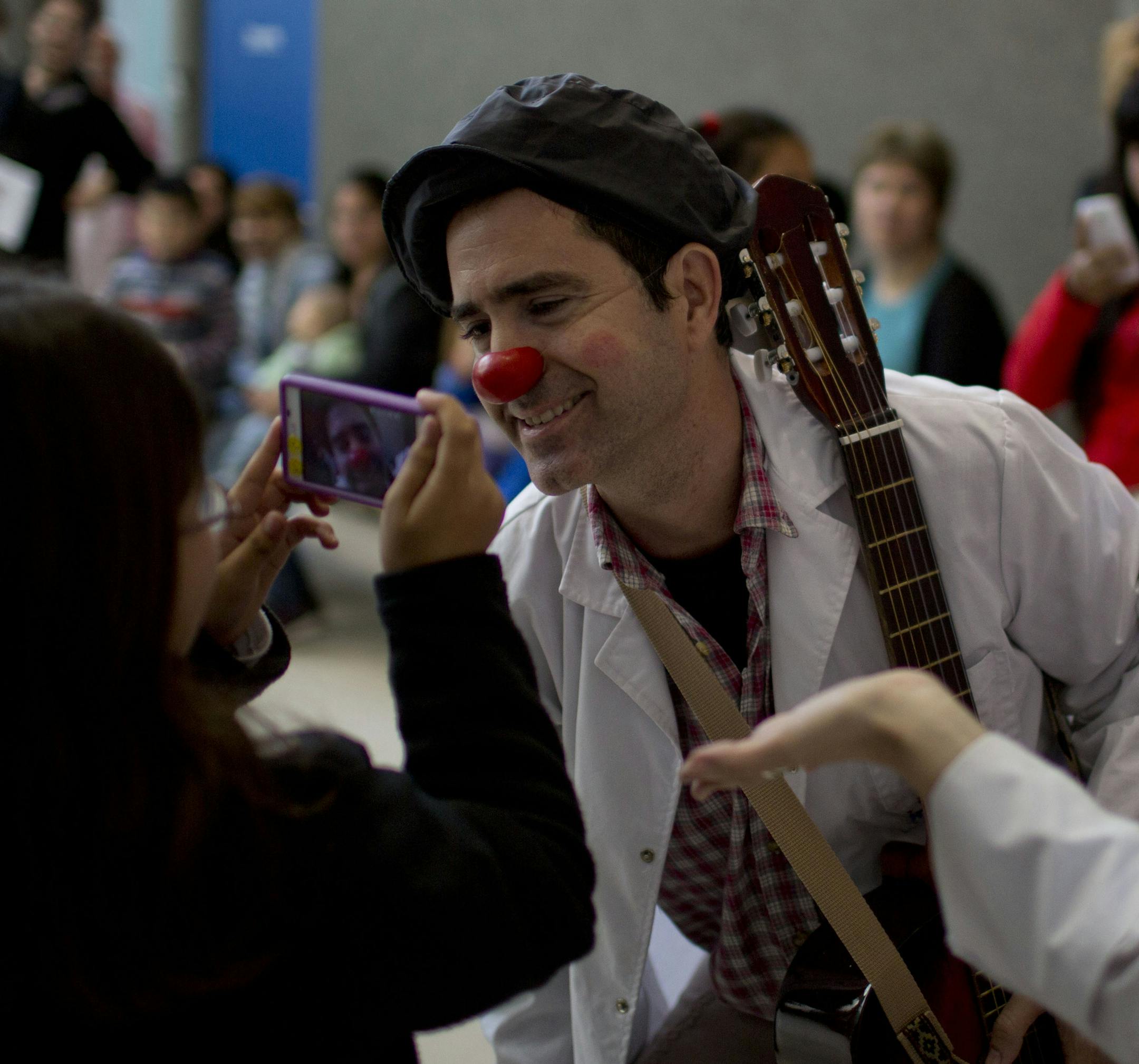 Clown Gonzalo Amor poses for a picture during his rounds at a pediatric hospital in Buenos Aires, Argentina, Thursday, June 4, 2015. Tapping into the healing power of laughter, a new law in the province of Buenos Aires makes it obligatory that children’s hospitals provide specially trained clowns as part of their health care facilities. (AP Photo/Natacha Pisarenko)