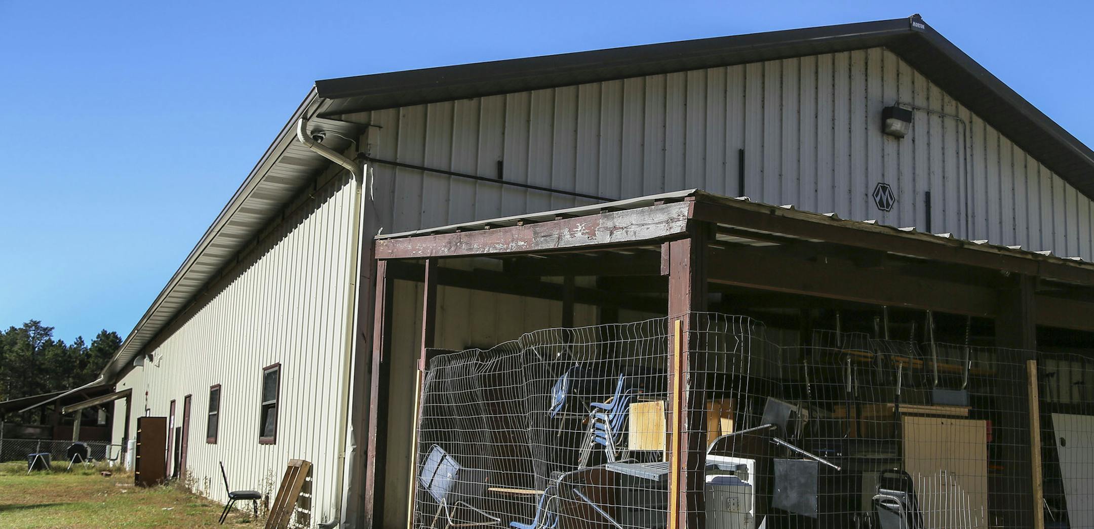 Bug-O-Nay-Ge-Shig High School was once a pole shed for vehicle maintenance and turned into a high school and is lacking much, including storage space. These chairs and desks were seen in an exterior storage space Tuesday, Oct. 21, 2014, in Bena, MN.](DAVID JOLES/STARTRIBUNE)djoles@startribune The Bug O Nay Ge Shig School is a culturally based alternative school that opened in 1975 with a mission of serving Ojibwe children and has matured into a fully accredited educational program. Bug School is