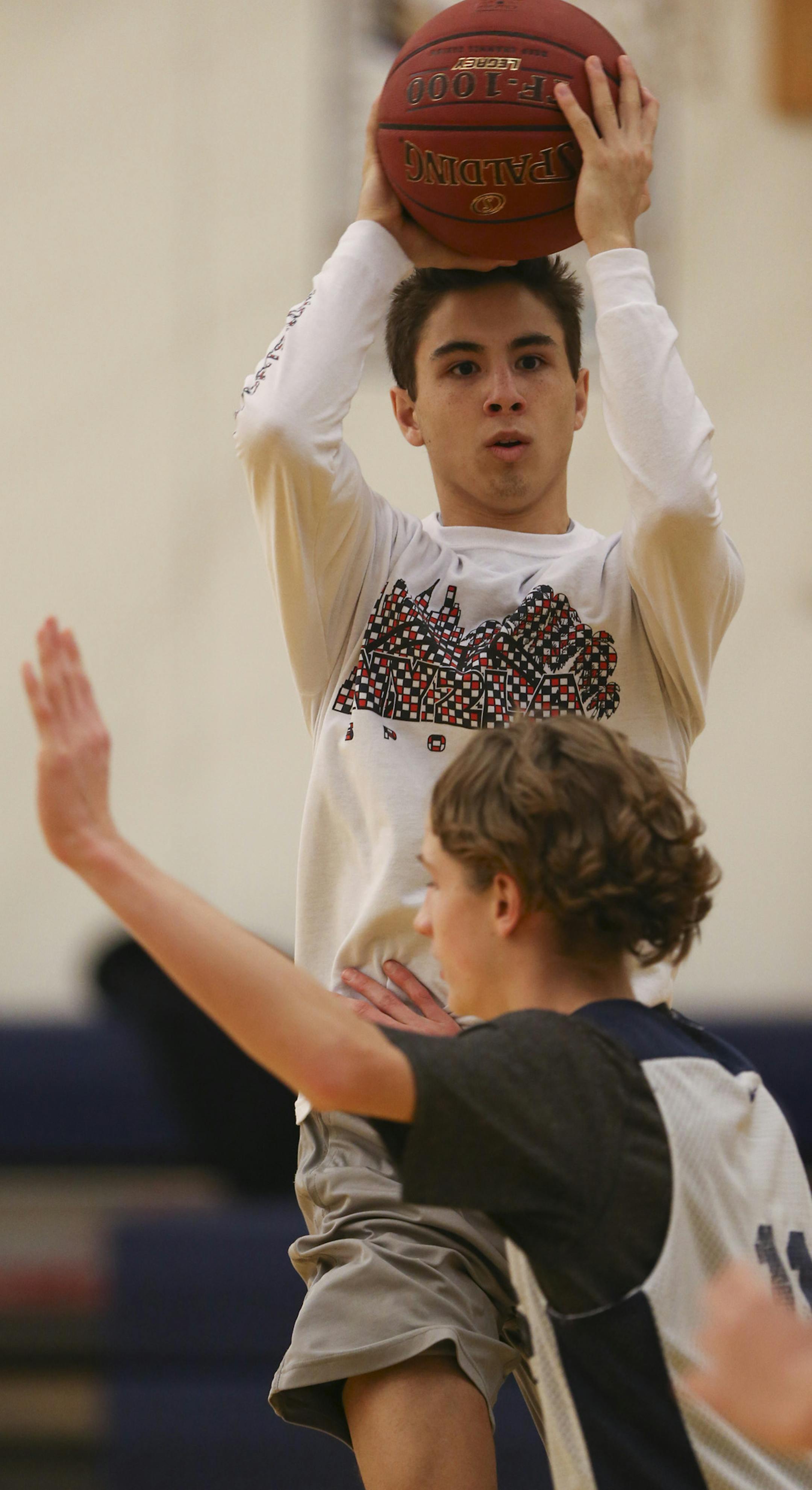 Senior guard Michael Gutierrez looked for a teammate to pass to during practice after school Thursday at St. Croix Preparatory Academy. ] JEFF WHEELER • jeff.wheeler@startribune.com St. Croix Preparatory Academy's boy's basketball team practiced after school Thursday, January 29, 2015.