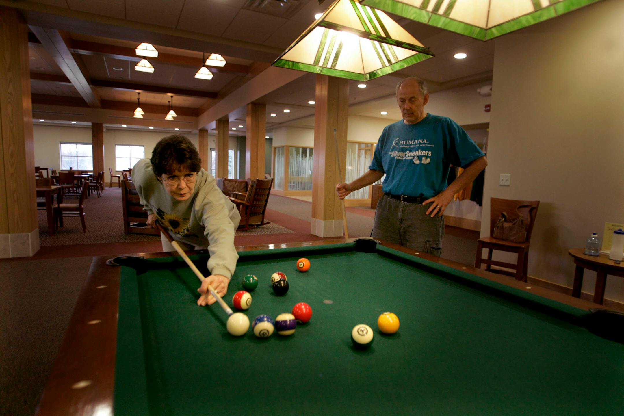 ELIZABETH FLORES� eflores@startribune.com November 6, 008 - Chaska, MN - After a yoga class for seniors, Nancy Krantz, 67, and her husband of 34 years, Mike Krantz, 67, played a game of pool in "The Lodge," at the Chaska Community Center. Carver County has been designated as one of the best places for seniors in the country by "Money Magazine." The magazine said one of the reasons is that the county promotes healthy living and lifestyles for its population.