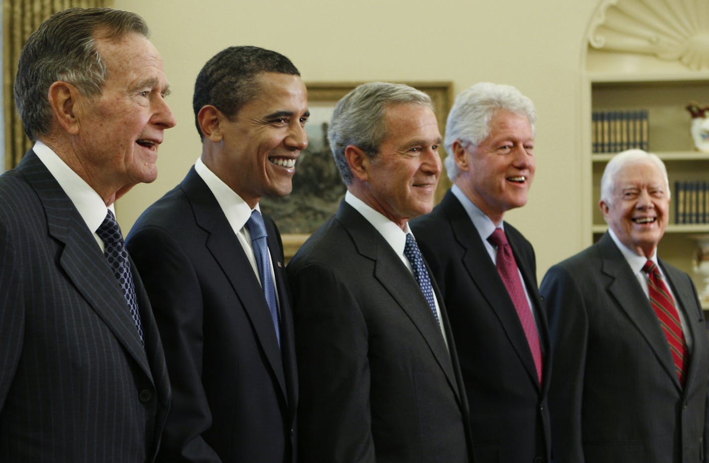 President George W. Bush, center, poses with President-elect Barack Obama, and former presidents, from left, George H.W. Bush, left, Bill Clinton and Jimmy Carter, right, Jan. 7, 2009, in the Oval Office of the White House in Washington.