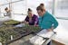 Students in Cheryl Morales' ethnobotany class at Aaniiih Nakoda College track plants' growth by documenting greenhouse environmental conditions, sunri