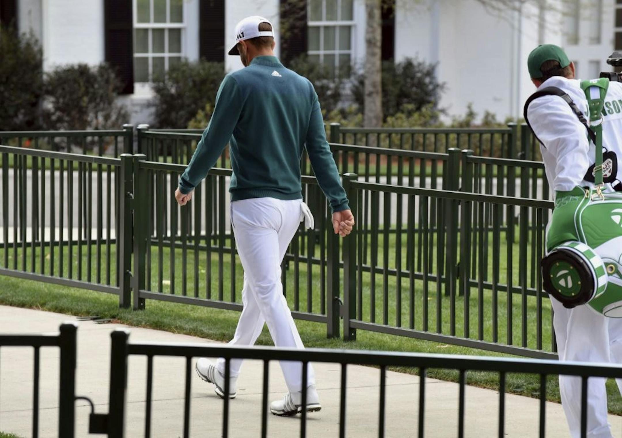 Dustin Johnson walked off the first tee Thursday after deciding not to play in the Masters. The world's No. 1-ranked player was forced to withdraw because of a lower back injury suffered less than 24 hours earlier in a freak fall at the home he was renting for the week.