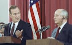 FILE - In this Oct. 29, 1991, file photo, President George H.W. Bush gestures during a joint news conference with Soviet President Mikhail Gorbachev, 
